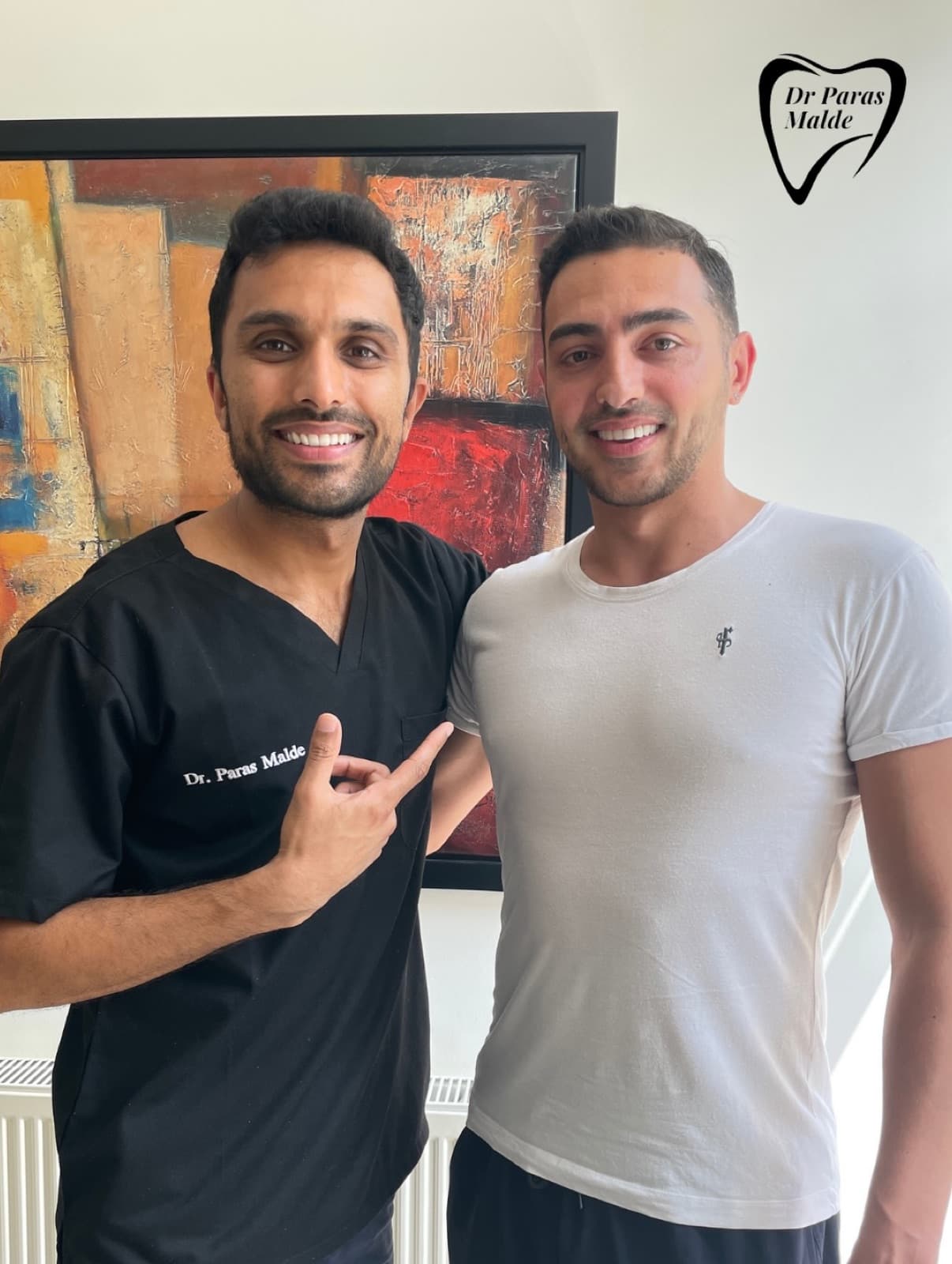 Dr Paras Malde with a patient at the practice
